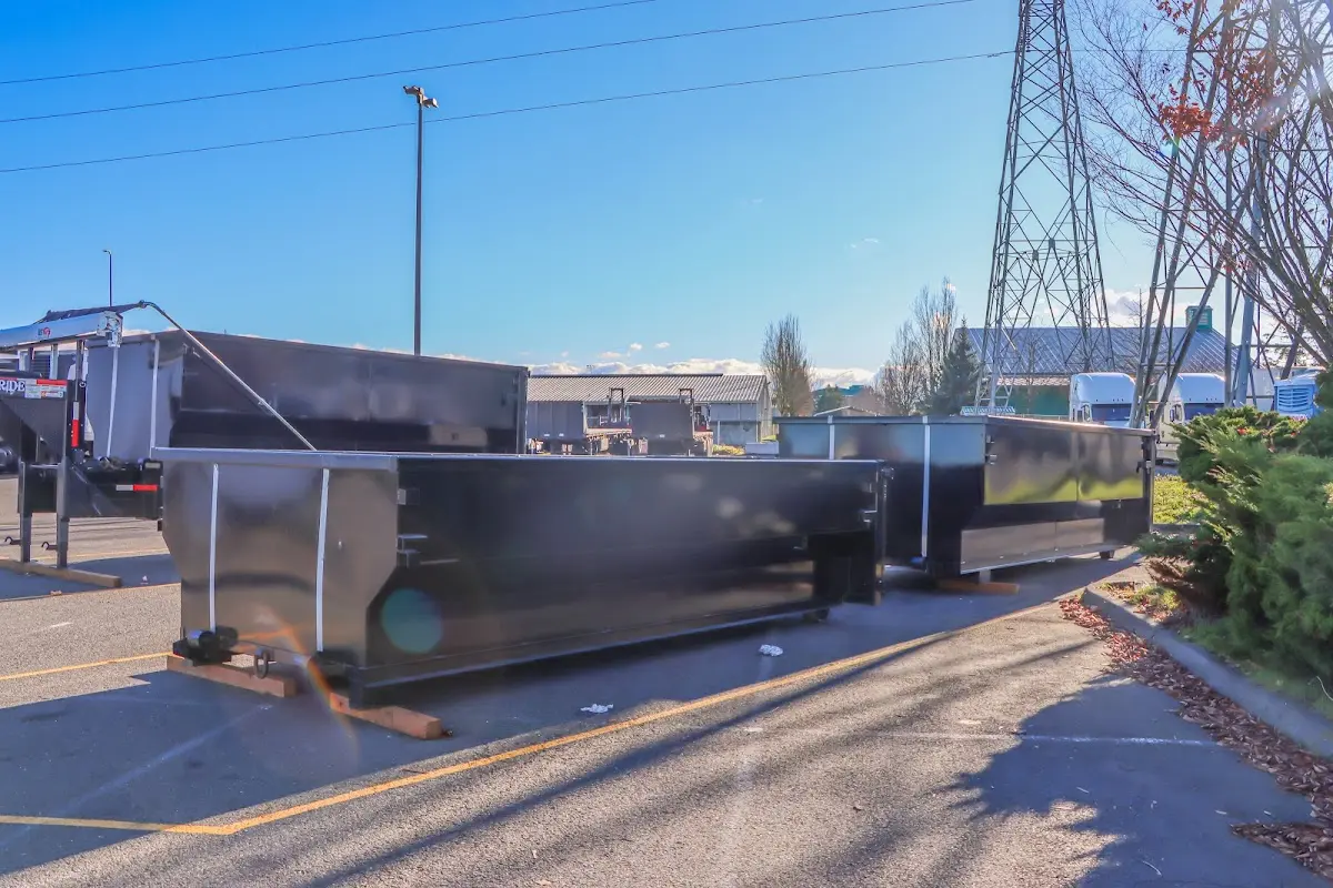 Roll-off dumpster ready for waste disposal at job site for Concrete Dumpster Rental in Anderson